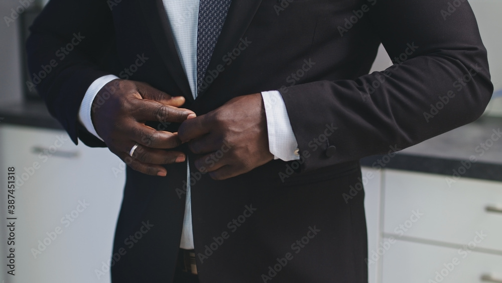 Man Buttoning the Jacket - Stylish African American. High quality photo