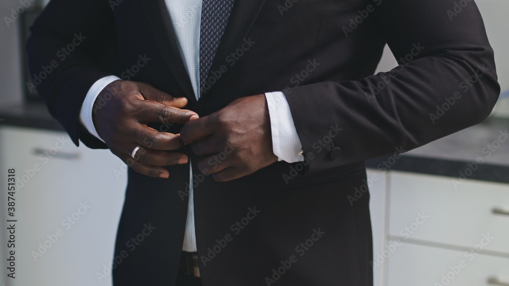 Man Buttoning the Jacket - Stylish African American. High quality photo Man Buttoning the Jacket - Stylish African American. High quality photo