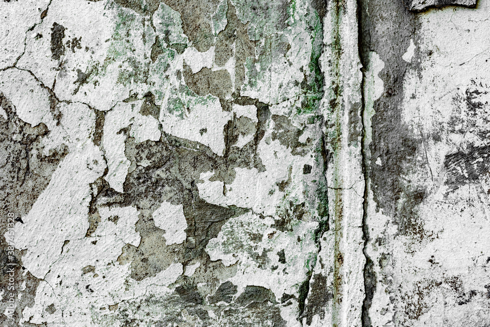 Texture of a concrete wall with cracks and scratches which can be used as a background Texture of a concrete wall with cracks and scratches which can be used as a background