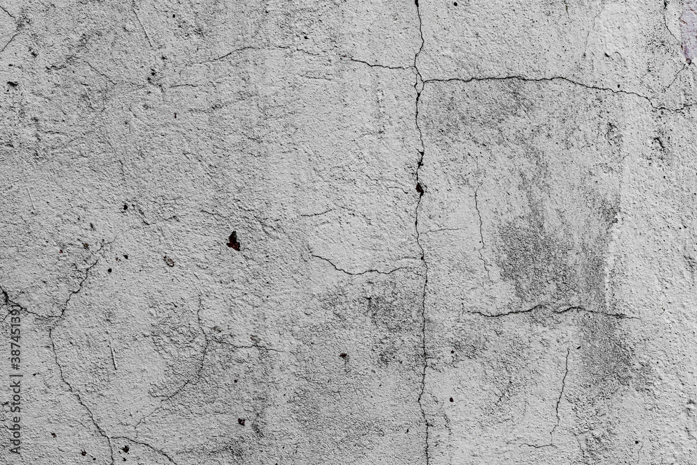 Obraz premium Texture of a concrete wall with cracks and scratches which can be used as a background