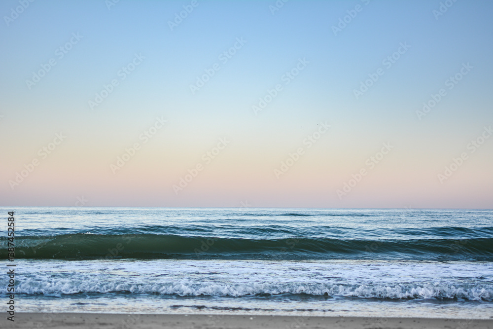 Crest of a wave in the Black Sea at sunset, selective focus. Sea waves background series images.