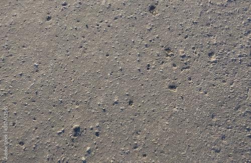 Texture of gray bumpy road