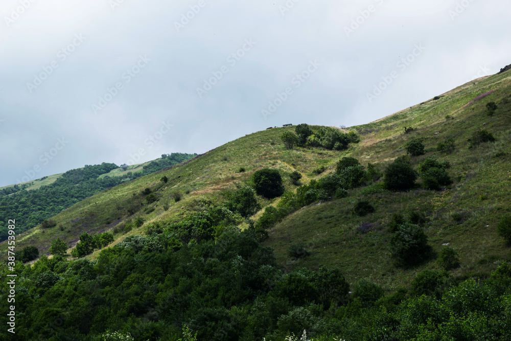 View of the mountains of the North Caucasus. Mountains in the clouds in summer