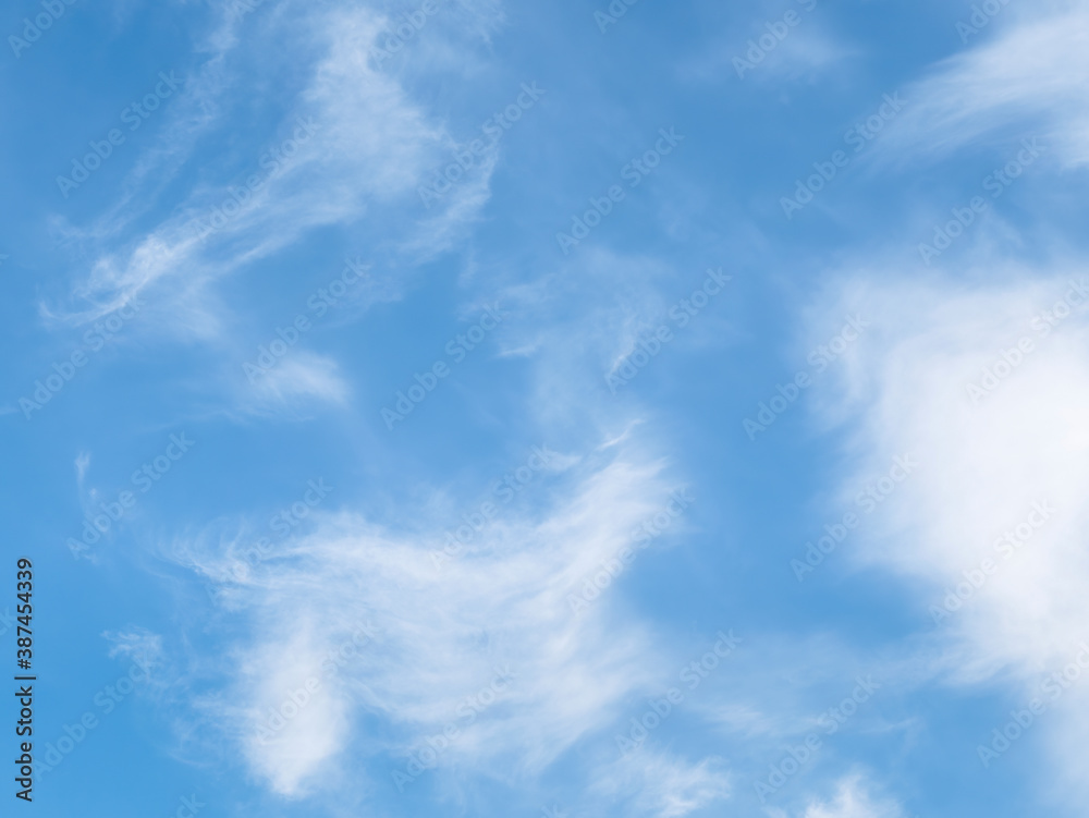 White smooth clouds on a blue sky background.