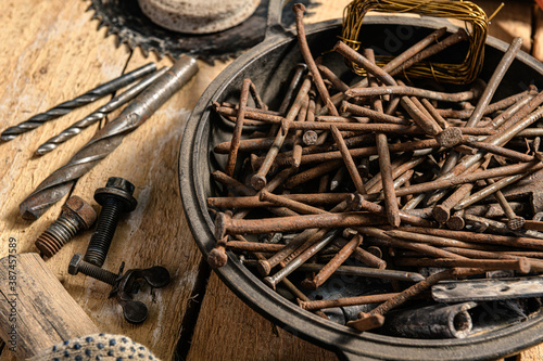 Old vintage household hand tools still life on a wooden background in a DIY and repair concept