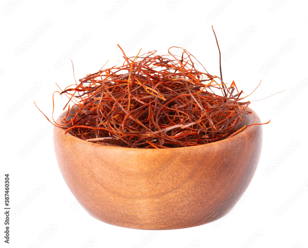 Fototapeta premium Red chili pepper threads in wooden bowl, isolated on white background. Close-up.