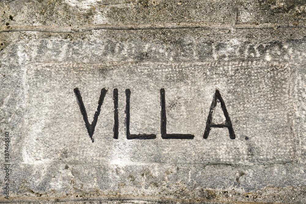 Close-up of a grey, concrete background with the written Close-up of a grey, concrete background with the written