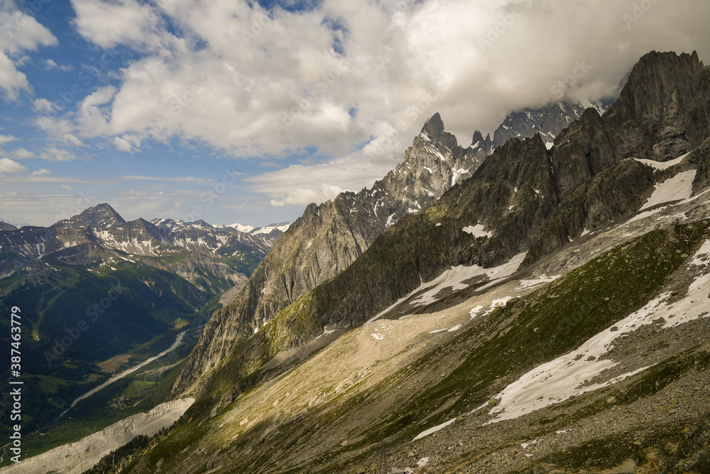 Scenic view of the massif of Mont Blanc with the Aiguille Noire de Peuterey peak and the Val Veny Valley in summer, Courmayeur, Aosta Valley, Alps, Italy