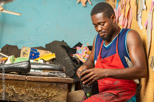 image of african man, with foot wear-workshop concept photo