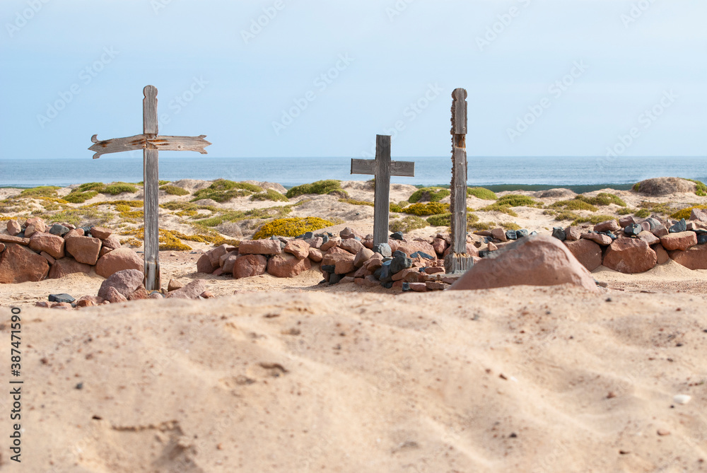 Skeleton Coast, Namibia.. Cemetery with old wooden crosses near Cape Cross.