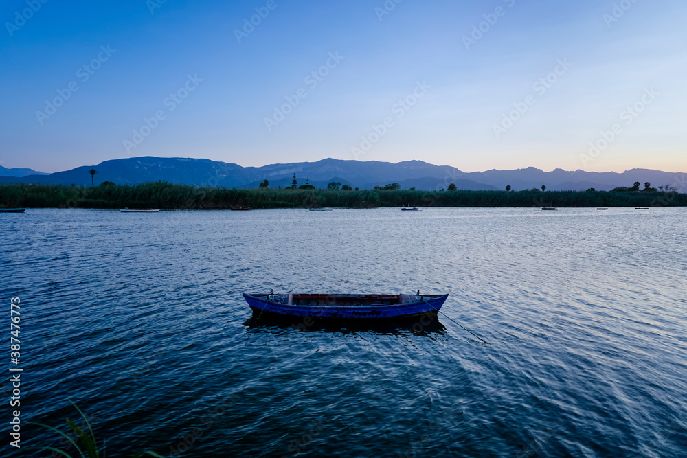 boats in the lagoon at sunset