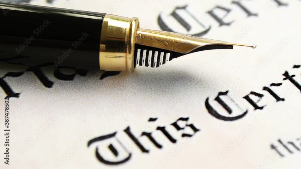 Fountain pen on marriage certificate dolly shot Fountain pen on marriage certificate dolly shot