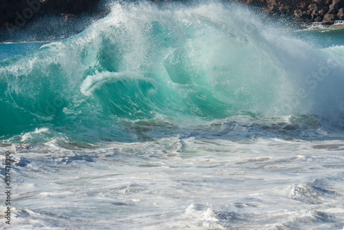 Ferocious wave slamming the shore in Hawaii