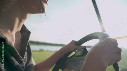 Wallpaper Mural close up shot of young asian female golfer smile and happy while driving golf car inside beautiful green golf course, having fun relax on holidays summer vacation, spring valley, hot sunny weather Torontodigital.ca