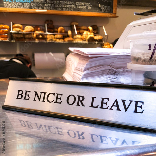 Be Nice or Leave Sign on Counter of Deli