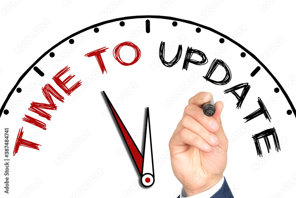 Hand writing TIME TO UPDATE on drawn clock with marker on transparent