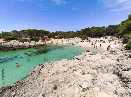 Fototapeta Naklejka Na Ścianę i Meble -  Playa Cala Des Talaier famous paradise beach with turquoise water and pine forests on south coast of Menorca Island, Balearic Islands, Spain