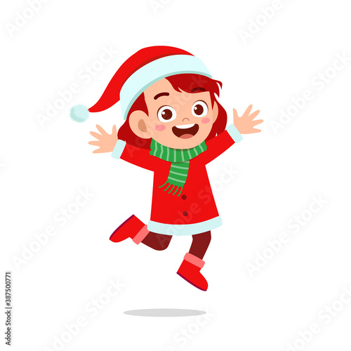 happy cute little kid boy and girl wearing red christmas costume and jump