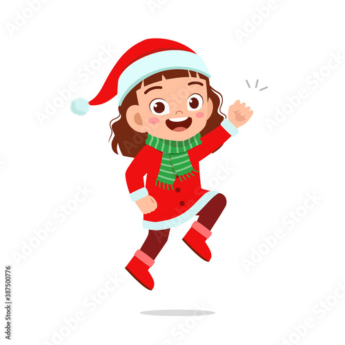 happy cute little kid boy and girl wearing red christmas costume and jump