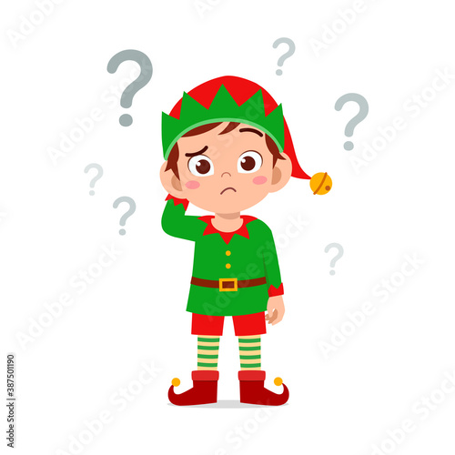 happy cute little kid boy and girl wearing green elf christmas costume and thinking