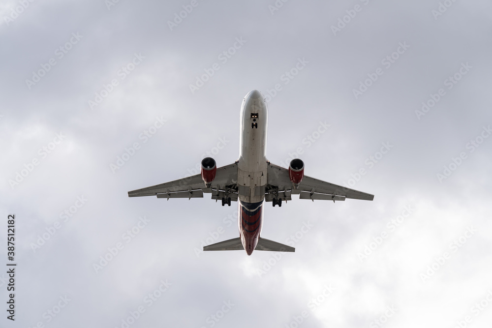 Airplane coming for landing with wheels down Airplane coming for landing with wheels down
