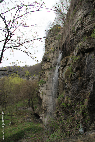 small waterfall from the wall and cliff © dyachenkopro