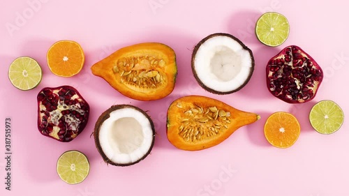 Wallpaper Mural Slices of pumpkin, coconut, pomegranate, limes and orange appear on pink theme. Stop motion  Torontodigital.ca