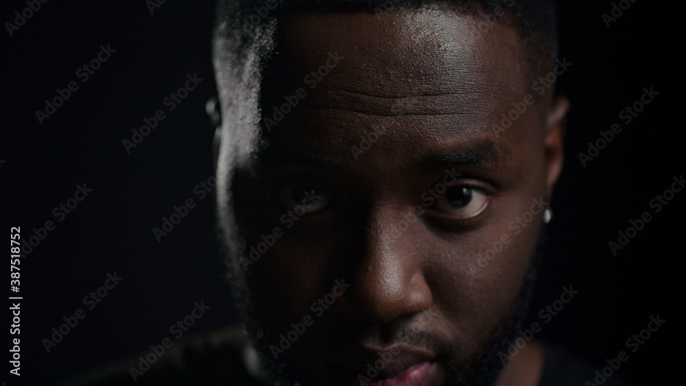 African american man laughing indoors. Positive male person smiling in studio African american man laughing indoors. Positive male person smiling in studio