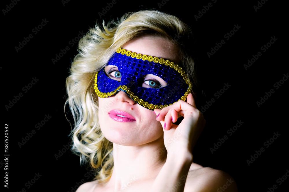 Woman in blue eye mask with bare shoulders,. Woman in blue eye mask with bare shoulders,.