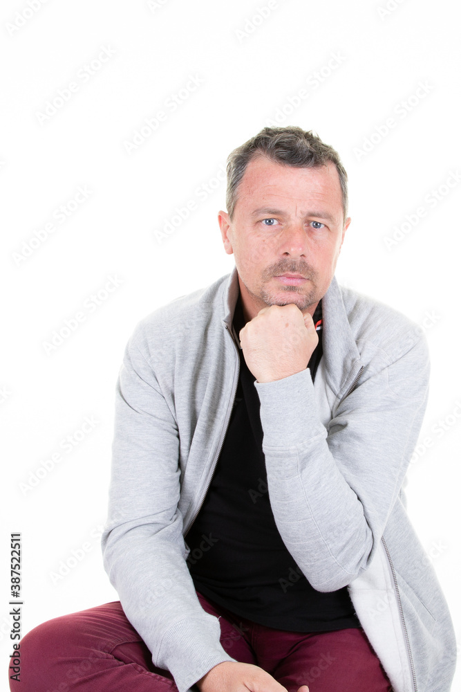 Portrait of happy handsome middle aged man smiling with hand on chin Portrait of happy handsome middle aged man smiling with hand on chin