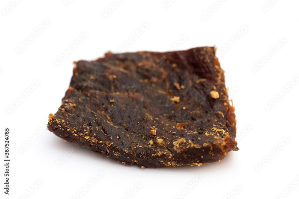 Piece of beef jerky on white. Piece of beef jerky on white.