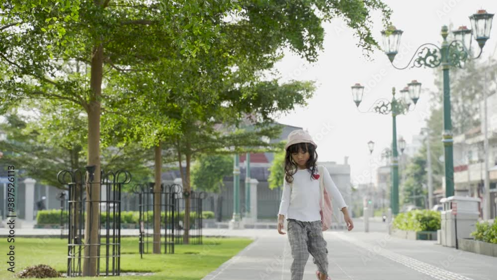 potrait little girl playing alone in the park potrait little girl playing alone in the park