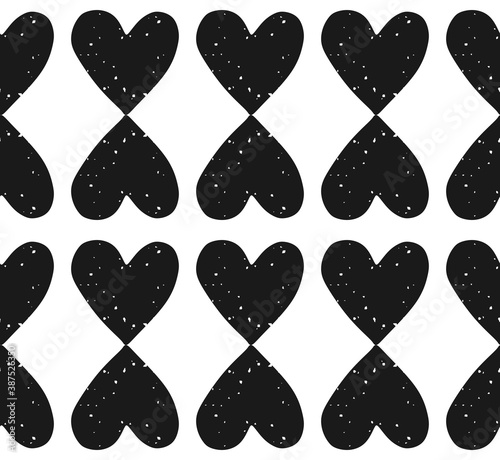 Valentine's Day block print seamless pattern with grunge textured black heart shaped ornament on white background