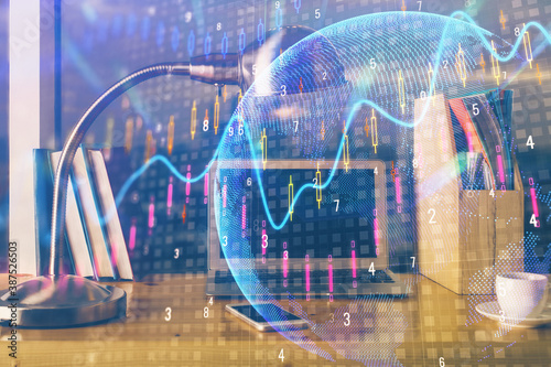 Multi exposure of graph and financial info and work space with computer background. Concept of international online trading.