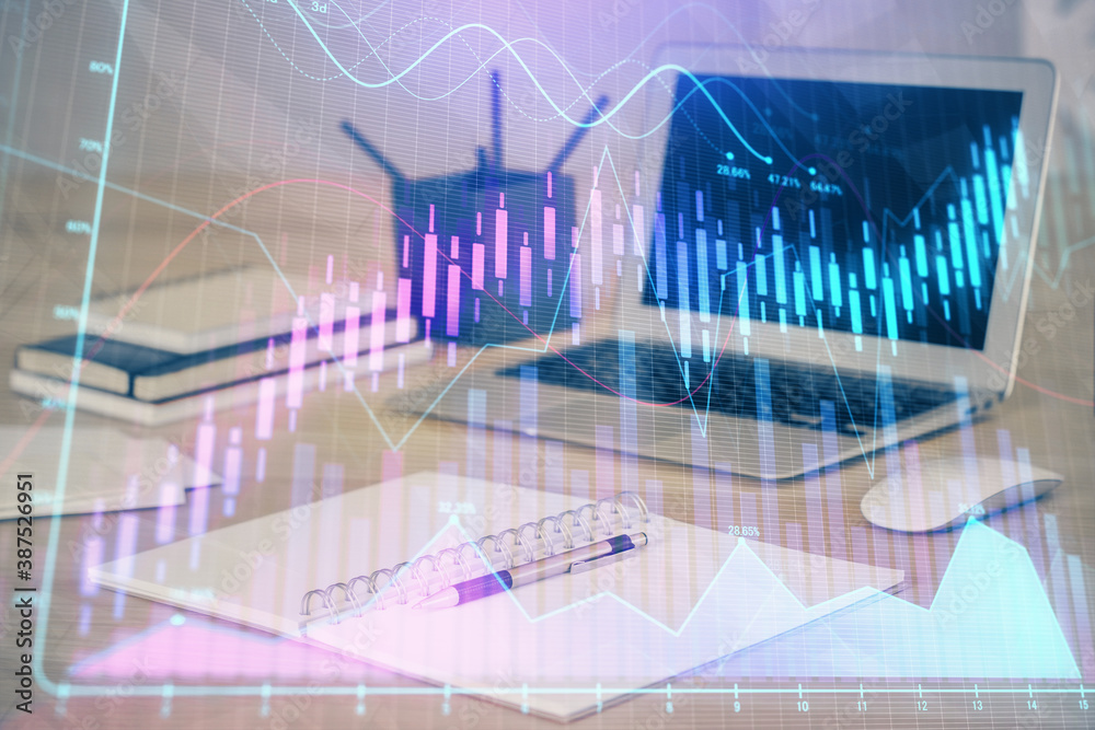 Forex market chart hologram and personal computer background. Multi exposure. Concept of investment. Forex market chart hologram and personal computer background. Multi exposure. Concept of investment.