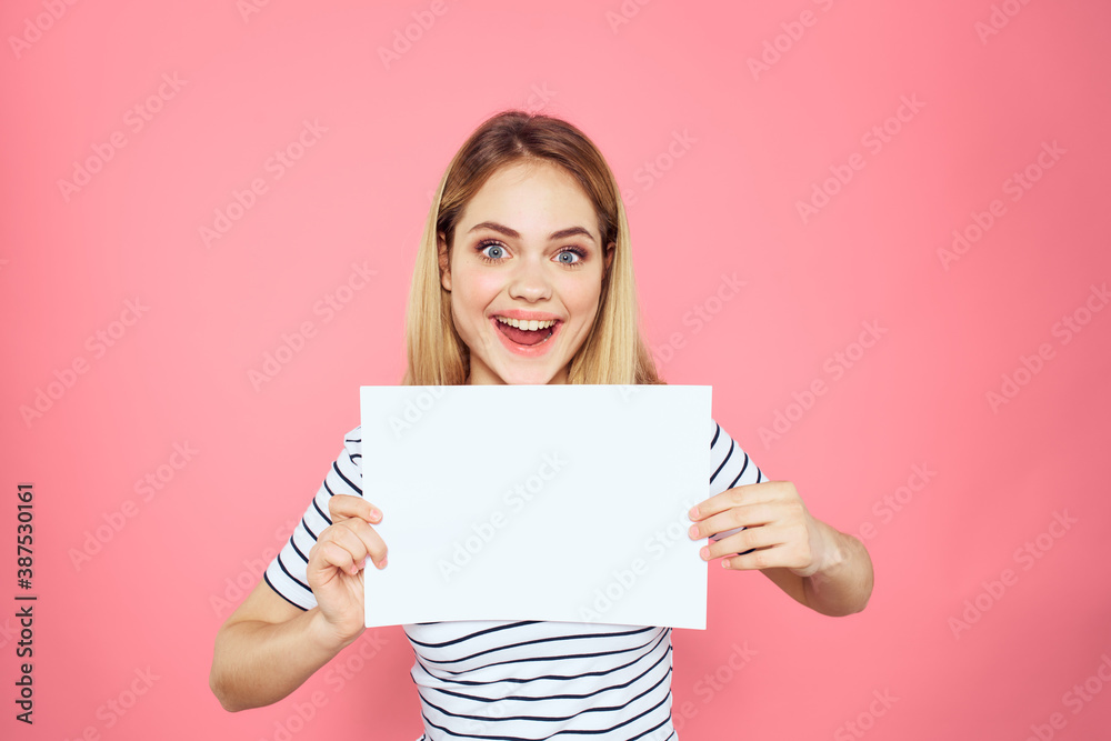 woman holding white sheet in her hands striped t-shirt emotions pink background woman holding white sheet in her hands striped t-shirt emotions pink background