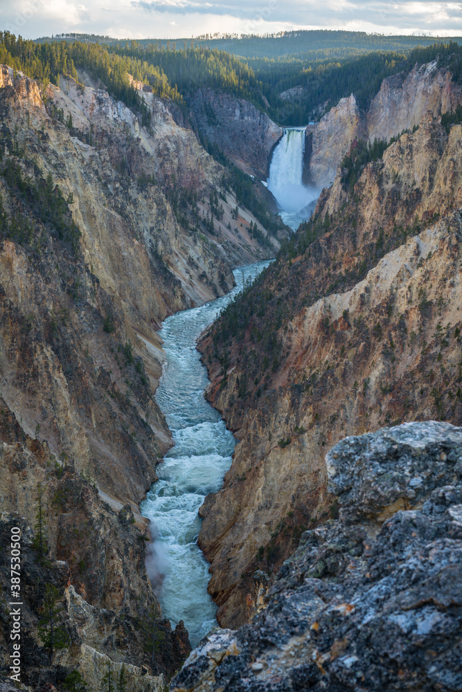 lower falls of the yellowstone national park from artist point at sunset, wyoming, usa