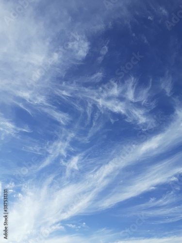 Beautiful Cirrus clouds in a bright blue sky.