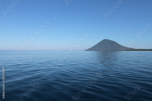 Blue sea and Manadotua island on a horizon. Bunaken marine park  North Sulawesi  Indonesia