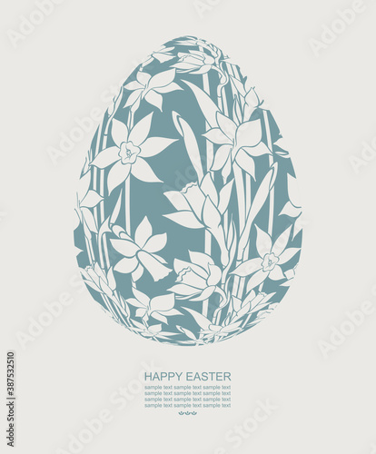 Easter background with decorative egg and copy space for your text. Easter egg painted with narcissus flowers. 