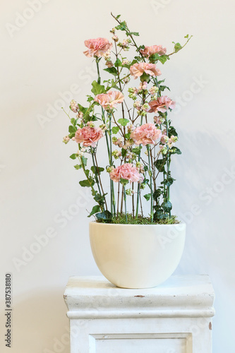 Modern floral arrangement with pink carnations.