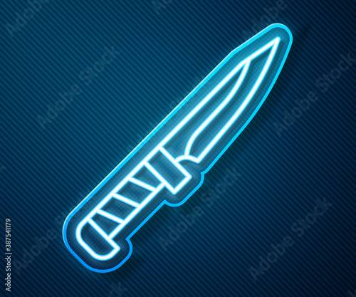 Glowing neon line Military knife icon isolated on blue background. Vector.