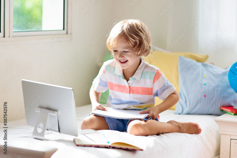 Online remote learning. School kids with computer. Online remote learning. School kids with computer.