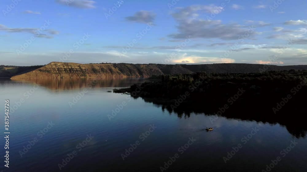 aerial view of fisherman at the boat on river. Fisherman life style aerial view of fisherman at the boat on river. Fisherman life style