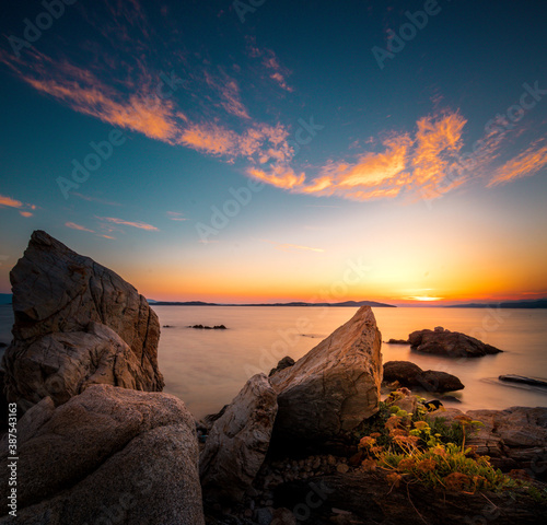 Sunrise or sunset in Greece by the sea. Nice beach photo and landscape. Counter-shot in the morning with great clouds