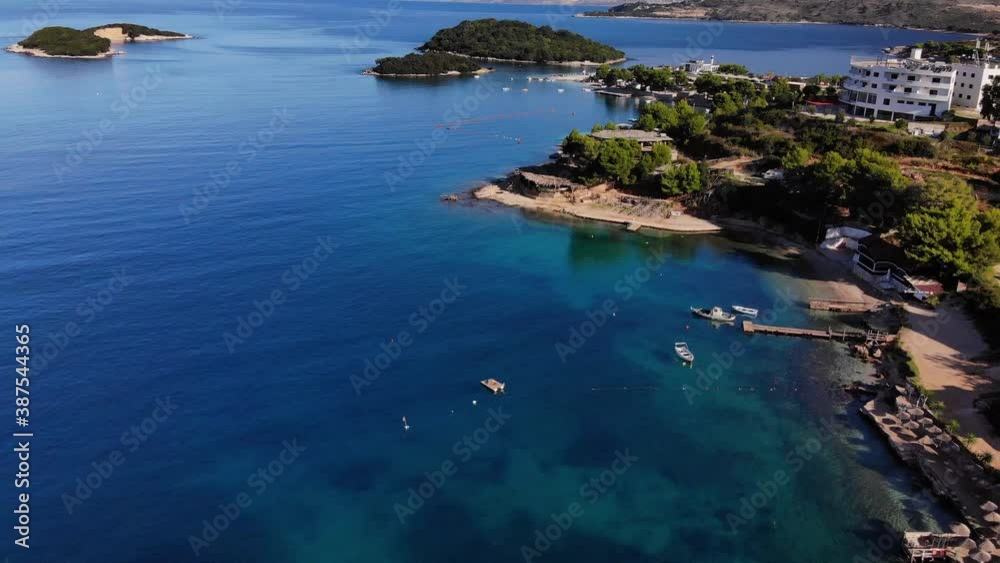 Flying drone over one of the most beautiful beaches of Albania, Ksamil Beach, Albania. Flying drone over one of the most beautiful beaches of Albania, Ksamil Beach, Albania.