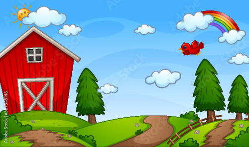Red barn farm in nature scene with rainbow in the sky