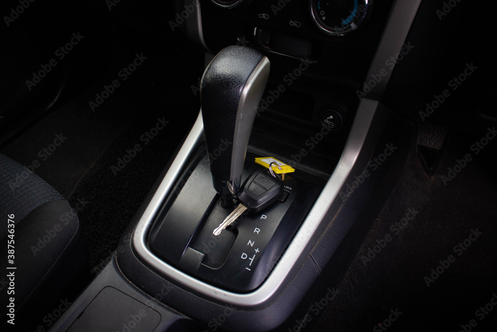 automatic transmission shift selector in the car interior. Closeup a manual shift of modern car gear shifter. automatic transmission shift selector in the car interior. Closeup a manual shift of modern car gear shifter.