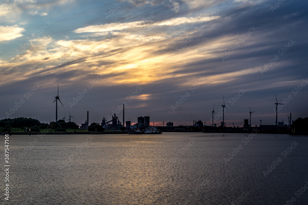 Fototapeta premium Sunset over Neustadt Port Bremen, Germany