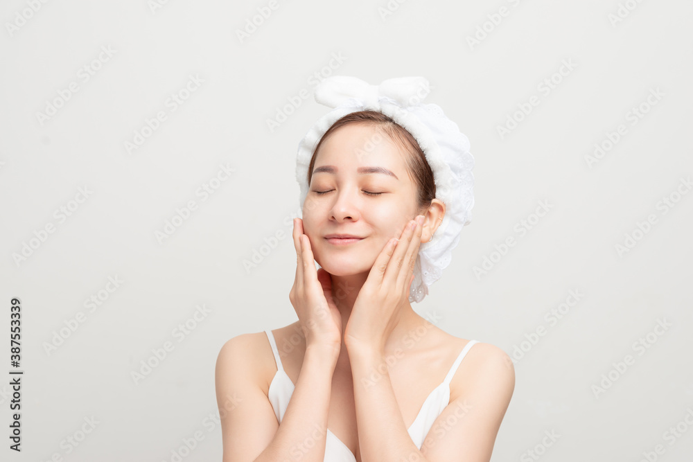 pretty lady wrap towel on head put facial moisturizer lifting hydrating moisturizing creme, skin care treatment concept
